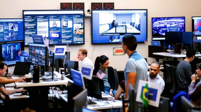 Employees work in Facebook's "War Room," during a media demonstration on October 17, 2018, in Menlo Park, California. - The freshly launched unit at Facebook's Menlo Park headquarters is the nerve center for the fight against misinformation and manipulation of the largest social network by foreign actors trying to influence elections in the United States and elsewhere. The war room, which will ramp up activity for the November 6 midterm US elections, is the most concrete sign of Facebook's efforts to weed out misinformation. (Photo by NOAH BERGER / AFP)