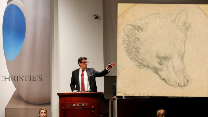 Auctioneer Andreas Rumbler takes bids on Monet's "Water Lilys," during Christie's Impressionist and Modern Art spring sale Thursday, May 12, 2016, in New York. A Frida Kahlo painting broke the world auction record for the artist, but also for any Latin American artist sold at auction. (AP Photo/Kathy Willens)