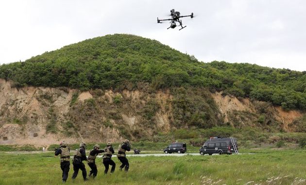 ZHOUSHAN, CHINA - APRIL 22, 2021 - Police patrol commandos use a drone to search the suspect area in Zhoushan, Zhejiang province, China, April 22, 2021. (Photo credit should read Costfoto/Barcroft Media via Getty Images)