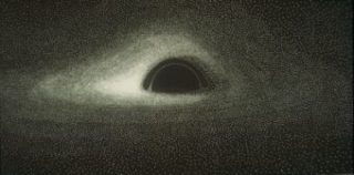 La prima simulazione della foto di un buco nero, pubblicata sulla rivista Astronomy & Astrophysics nel 1979. Crediti: Jean-Pierre Luminet/Cnrs Phototheque
